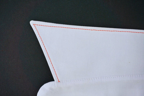 a close up of a collar point showing the topstitching