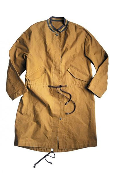 a picture of a jacket on a white back ground. the jacket is a mustard yellow coloured and has a green and gold ribbing neckline