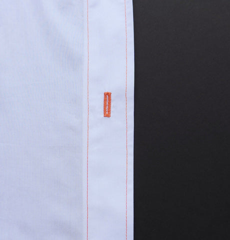 A picture of a shirt placket with orange stitching on it