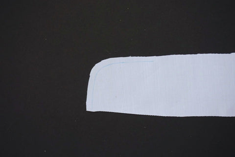 a picture of a white shirt collar with a seam allowance marked on in blue