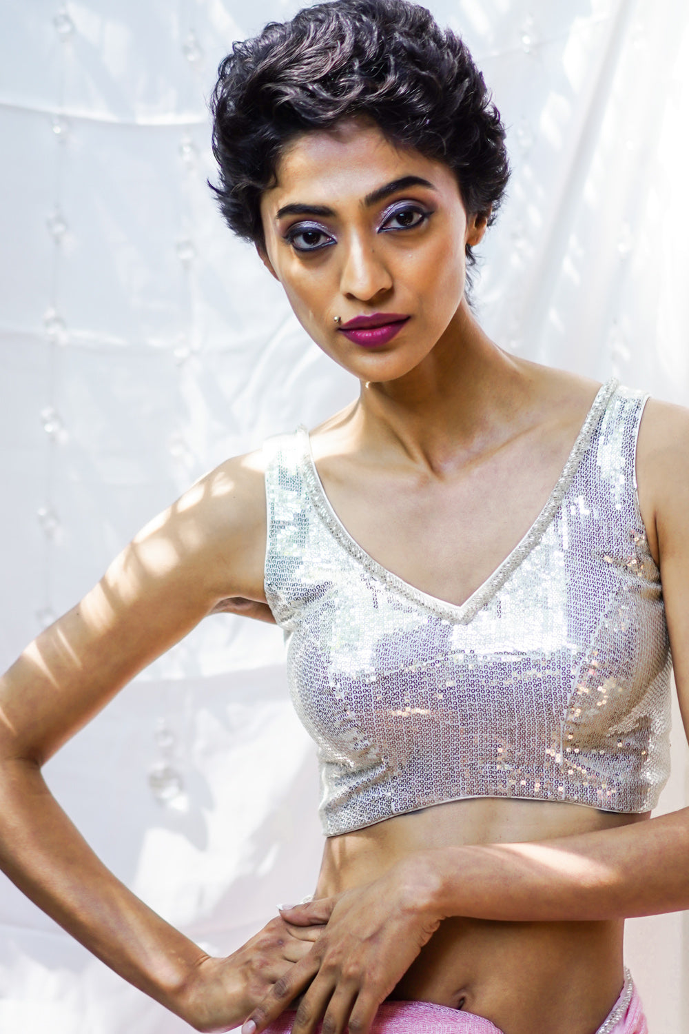 White sequin sweetheart neck blouse with net frills detailing.