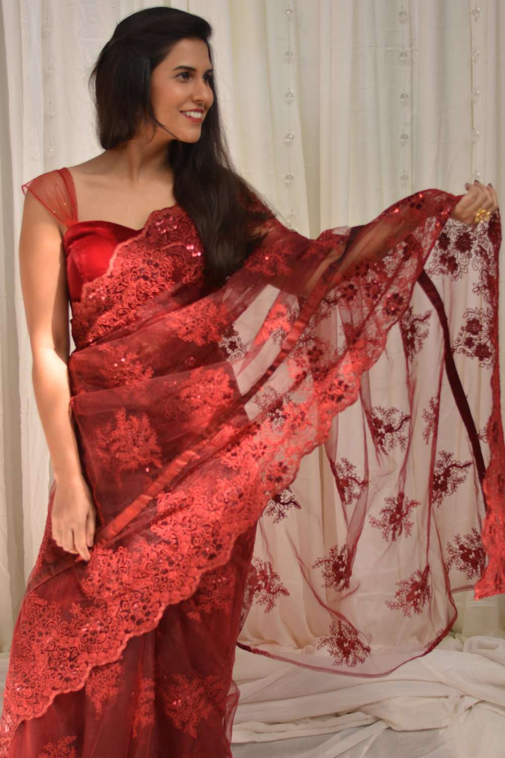 Red net saree with lacy self-coloured threadwork - House of Blouse