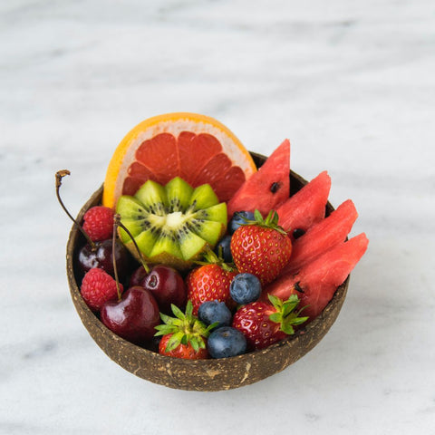 Bowl of fruits (kiwi, red fruits and orange)