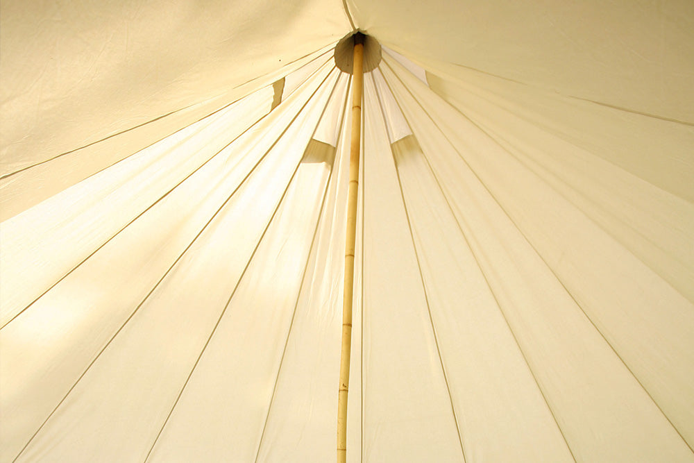 Interior of a bell tent with bamboo centre pole