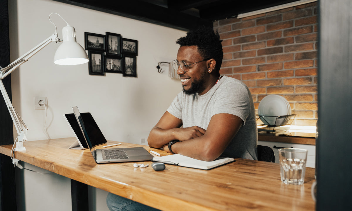 Individual working at desk, remote work set-up