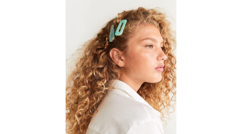 Curly side pinned look