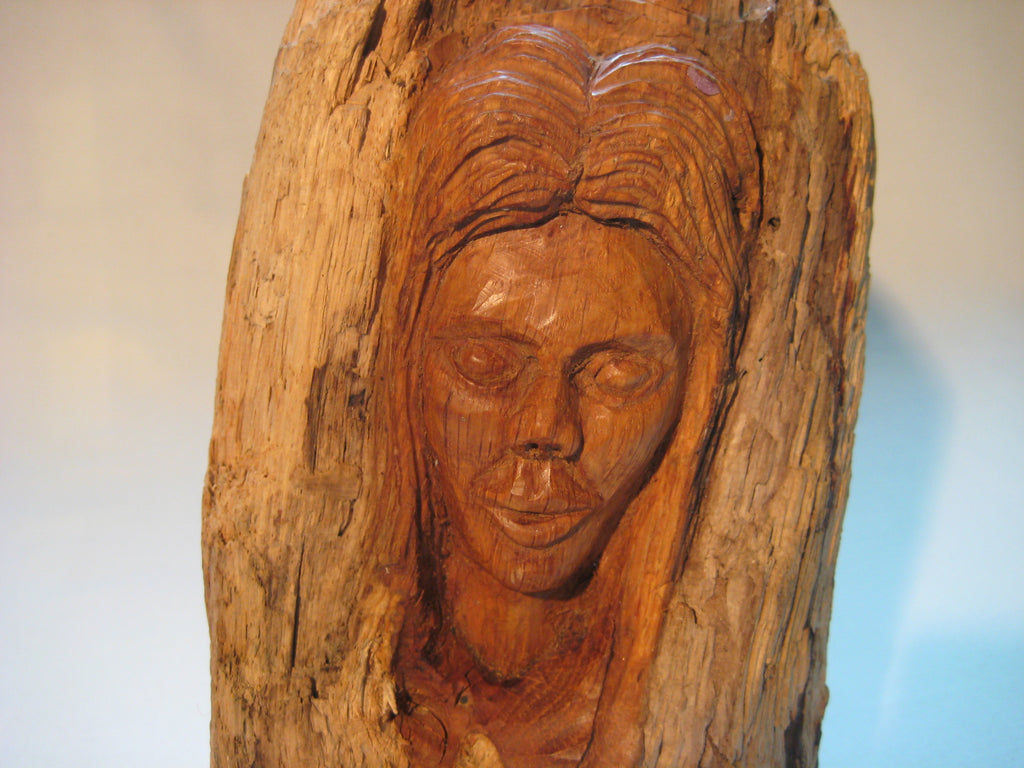 A bust (sculpture) of a woman carved out of a log – One-Offs