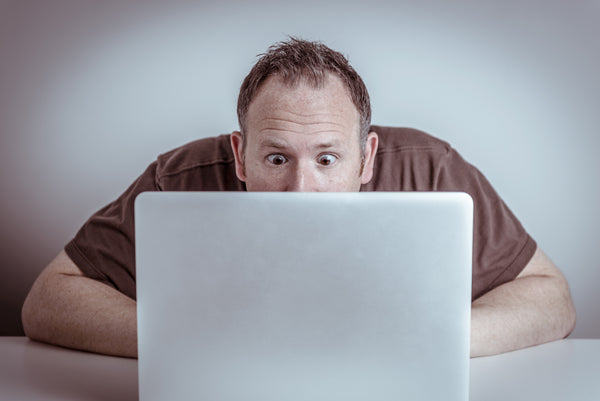 Man staring at computer screen