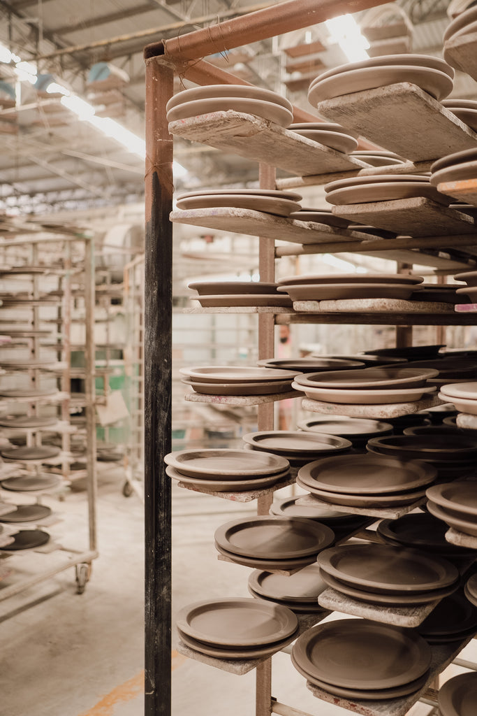 Handmade Dinner plates drying befire being fired in a kiln at Palinopsia Ceramics