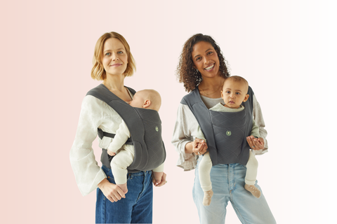 Gaia Baby Soft Newborn+ Carrier on two mothers, one with their baby in the parent-facing position and one in the world-facing position