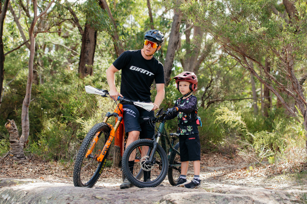 pro rider josh carlson and son on the trails