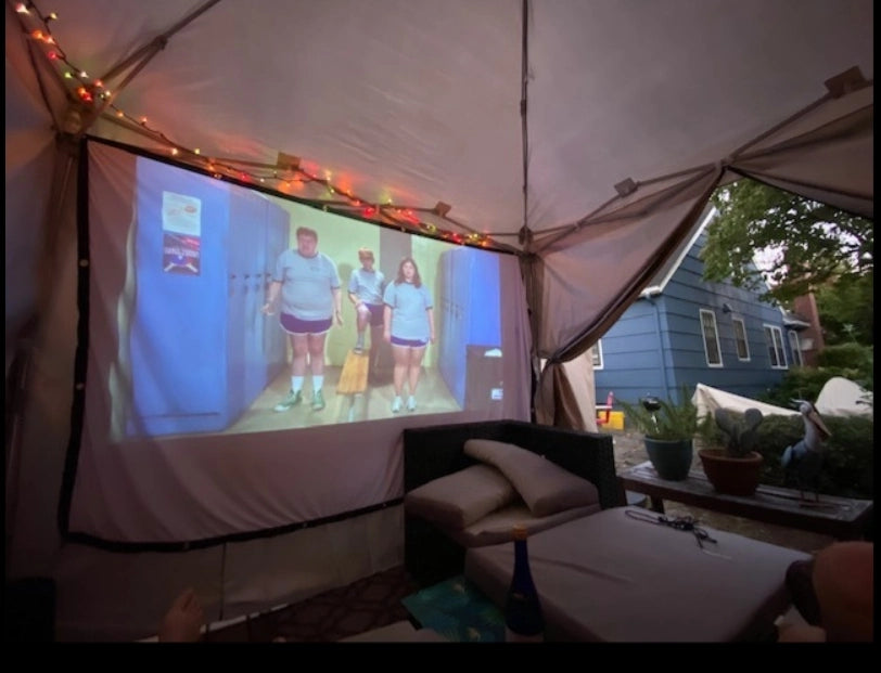 watch movie in canopy tent