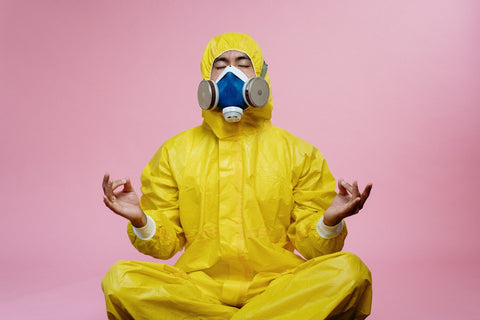 Guy doing meditation in a gas mask and a yellow protective suit #humour