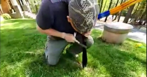 Sharpening a machete with a file