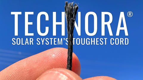 Close up image of yarns of black Technora in hand