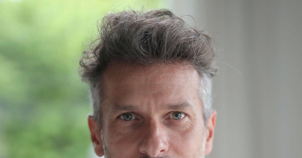 Man with gray hair in quiff hair style