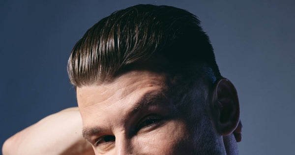Mans hair with a shiny slicked back hair style