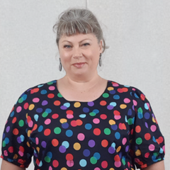 Belinda from Chasing Springtime Wearing Size 22 Blouse with colourful dots