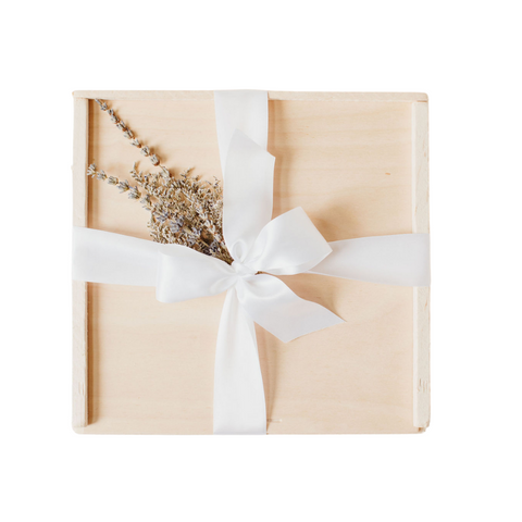close wooden slide top box, white ribbon, lavender floral bundle
