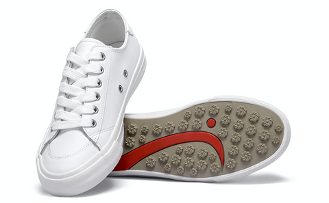 White leather shoes with one propped up on anther. The lower one having theWomen's Tops & Long T-Shirts,Sustainable Womenswear Shop logo in red on the sole