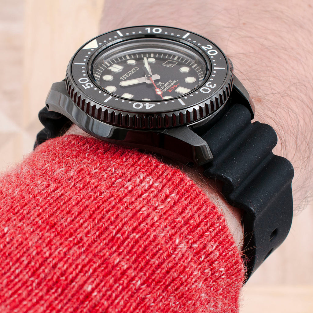 The Sinn's strap is also curved to fit the case. This, plus the elimination of a loose strap tail gives it a cleaner look and a more seamless wearing experience. The Seiko's soft silicone strap end tends to fall out of its metal keeper.