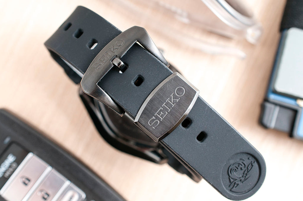 The Sinn's strap is also curved to fit the case. This, plus the elimination of a loose strap tail gives it a cleaner look and a more seamless wearing experience. The Seiko's soft silicone strap end tends to fall out of its metal keeper.