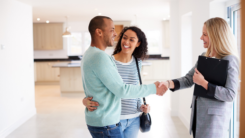 A couple talking to a realtor 