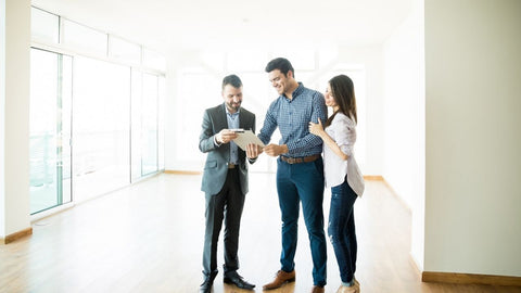 a realtor and a buyer signing a contract