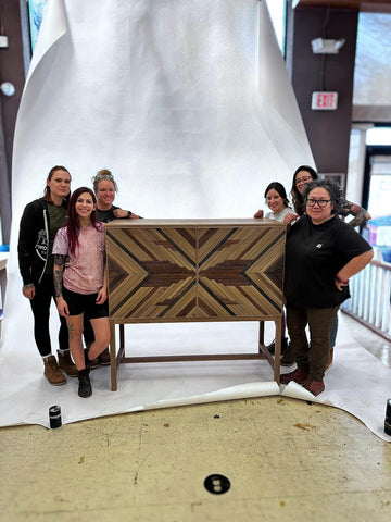 Team Villalobos with the white oak cabinet they built.