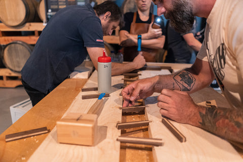 Team 2 working to set the wood pieces holding the ash live edge together