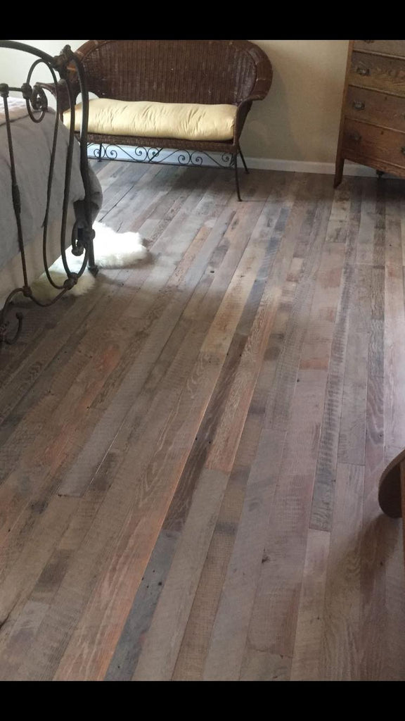 Rustic wood flooring in a bedroom