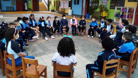 disabled children sit in a circle apart of Aynimundo