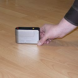 Gloss meter on wood flooring