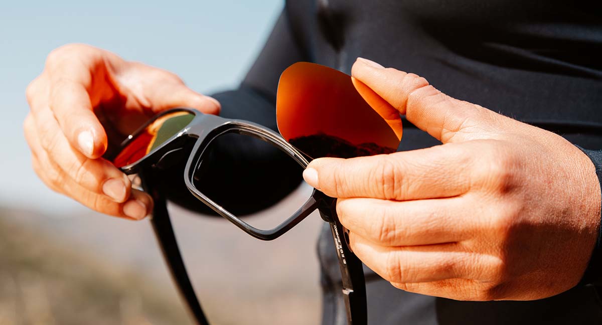 Image of person swapping sunglass lenses