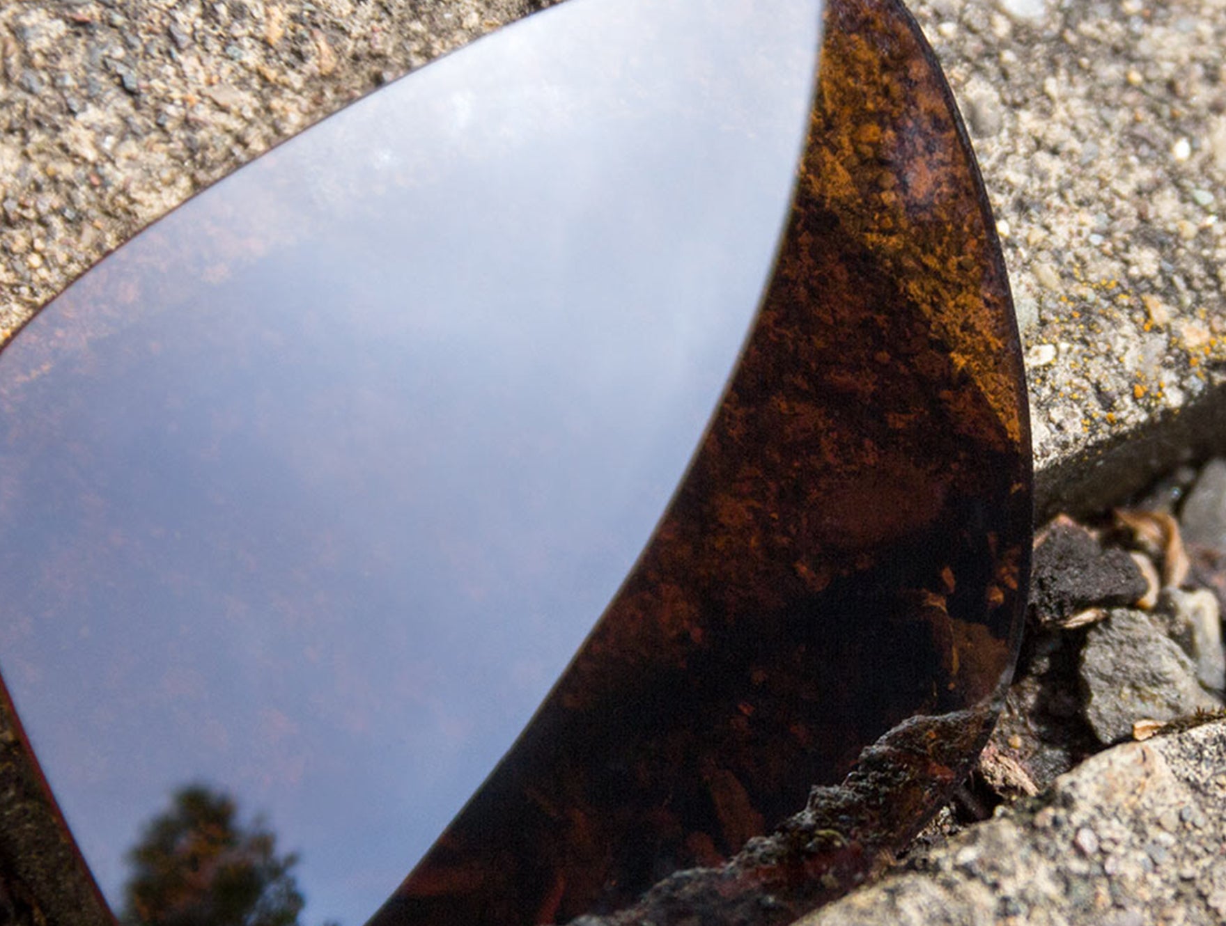 Close up of Flash Bronze Lenses reflecting the sky