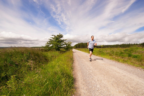 Man jogging on dirt road