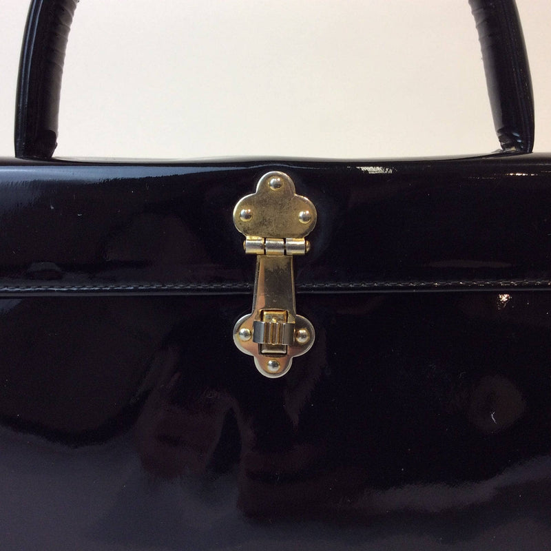 Close-Up of Snap-Latch of 1960s Black Patent Leather Style Pillbox Handbag. Sold by bohemevintage.com Montréal