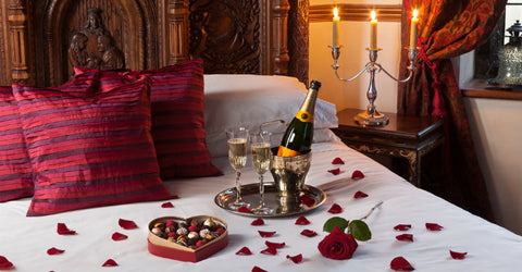 romantic champagne on bed
