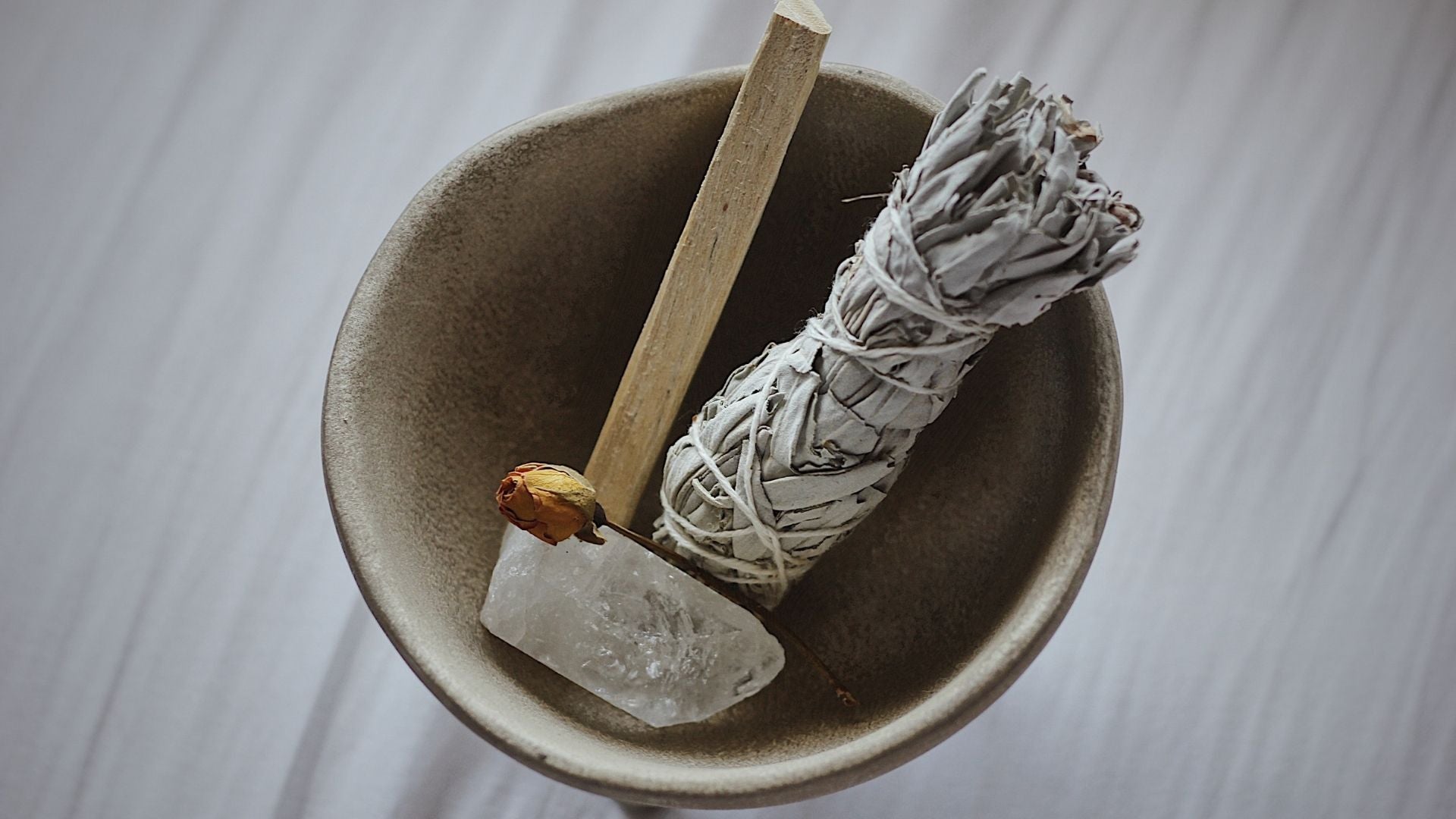 A cleansing kit bundle with Palo Santo, sage and a crystal