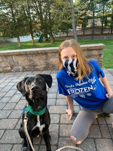 child and dog wearing pup scruffs