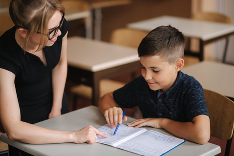 Student and Teacher Doing Special Education Math Lesson