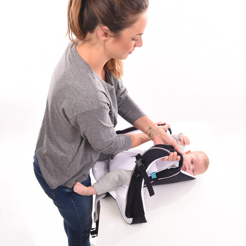 Cococho Baby Carrier- the baby is secured in the carrier before wearing