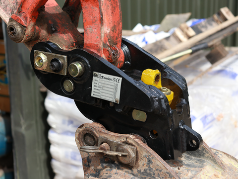 Rhinox autolock quick hitch coupler mounted to an excavator with a digging bucket fitted