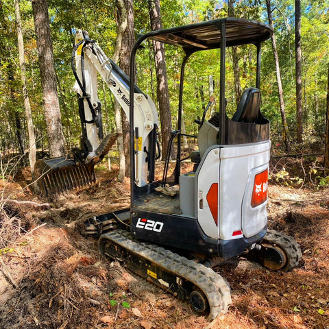 Rhinox customer Cale Schindler's Bobcat E20 fitted with a Rhinox rake riddle bucket