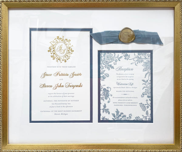 Wedding invitation custom framed in gold to highlight the gold and blue accents.