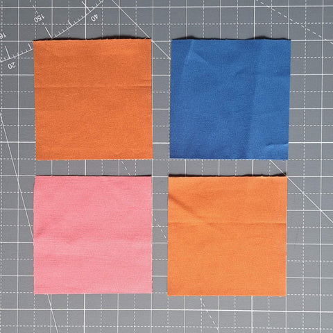 four fabric squares laid out into a four patch
