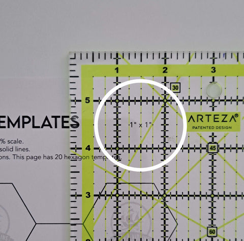 Close up of ruler on top of templates measuring the 1 inch square
