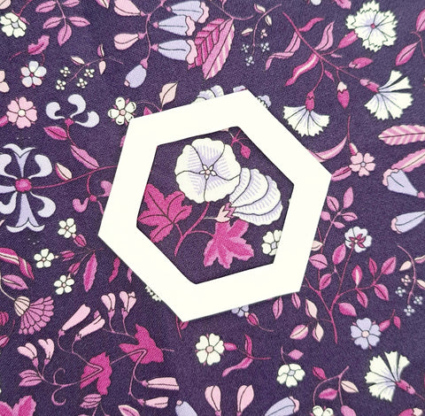 photos of a hexagon with the centre cut out to be used for fussy cutting fabrics