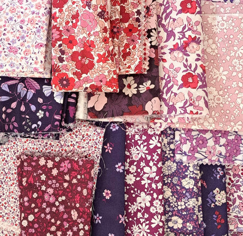 Photo of liberty of london quilting cottons; florals on purple and magenta