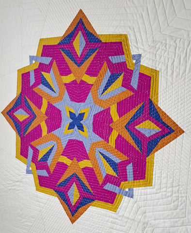 Full picture of the nesting phoenix star quilt on a cream background